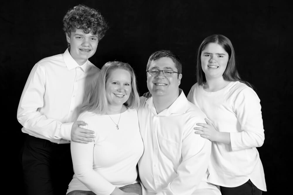 Image of Just Love Coffee Cafe - Carmel, Indiana, owners P.J. and Erika Steele with their children.