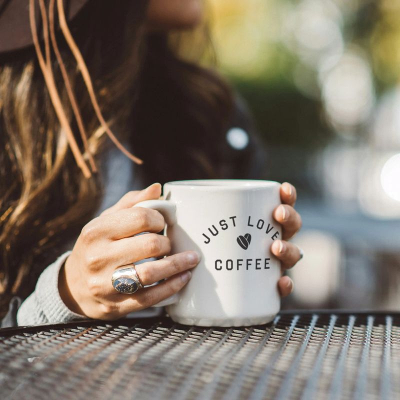 JLCC customer with coffee mug